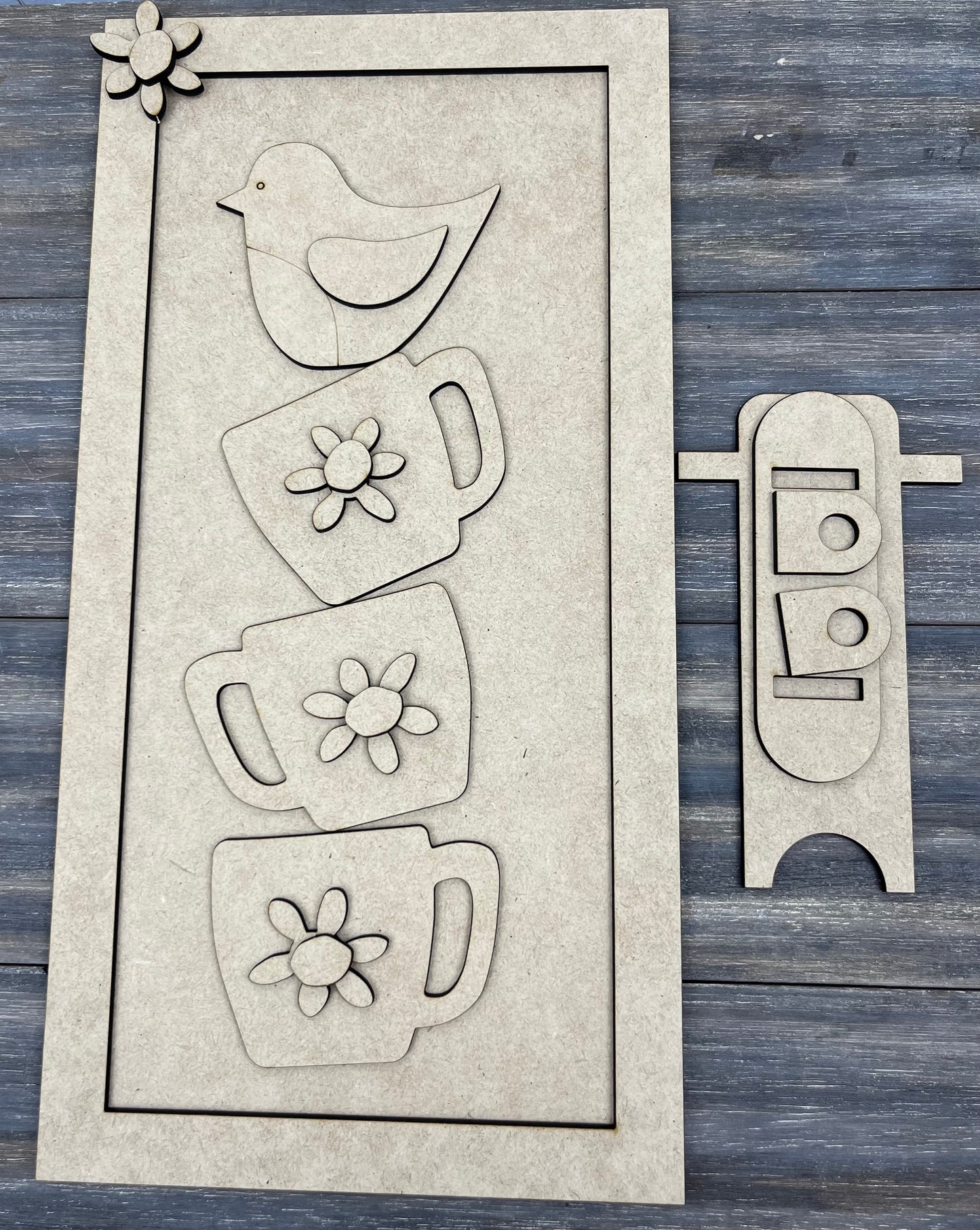 STACKING CUPS AND BIRD SIGN