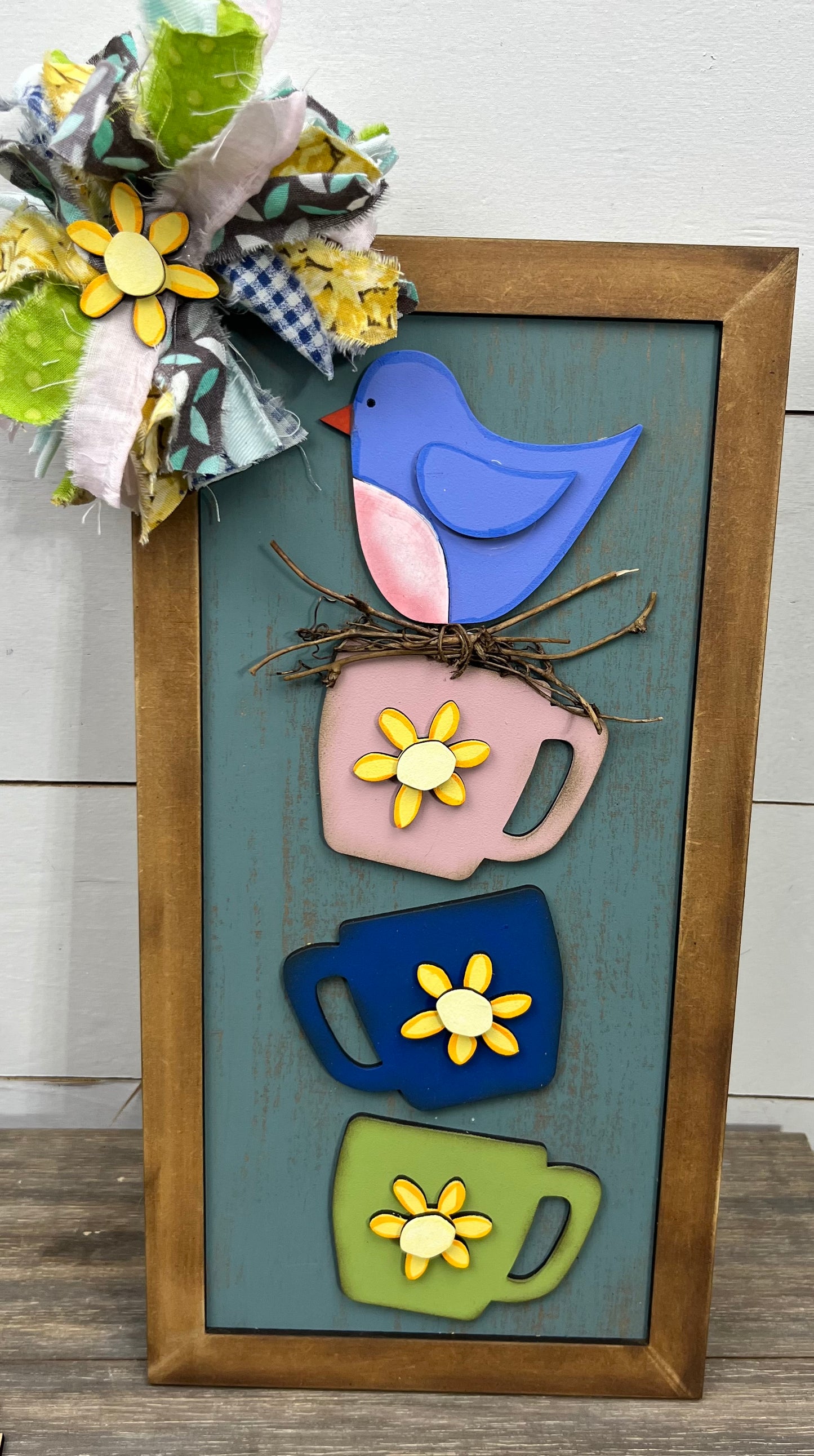 STACKING CUPS AND BIRD SIGN